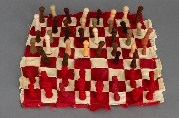 A knit chess board with knitted pieces